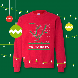 Red holiday sweater featuring métro station puns